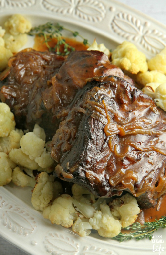 Slow cooked, melt in your mouth Pot Roast with Coffee Gravy and caramelized onions is the perfect comfort food for the chilly winter months!