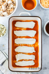 Cream cheese spooned over buffalo sauce.