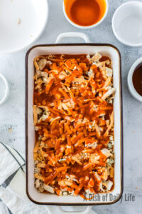 buffalo sauce poured over all uncooked sauce ingredients.