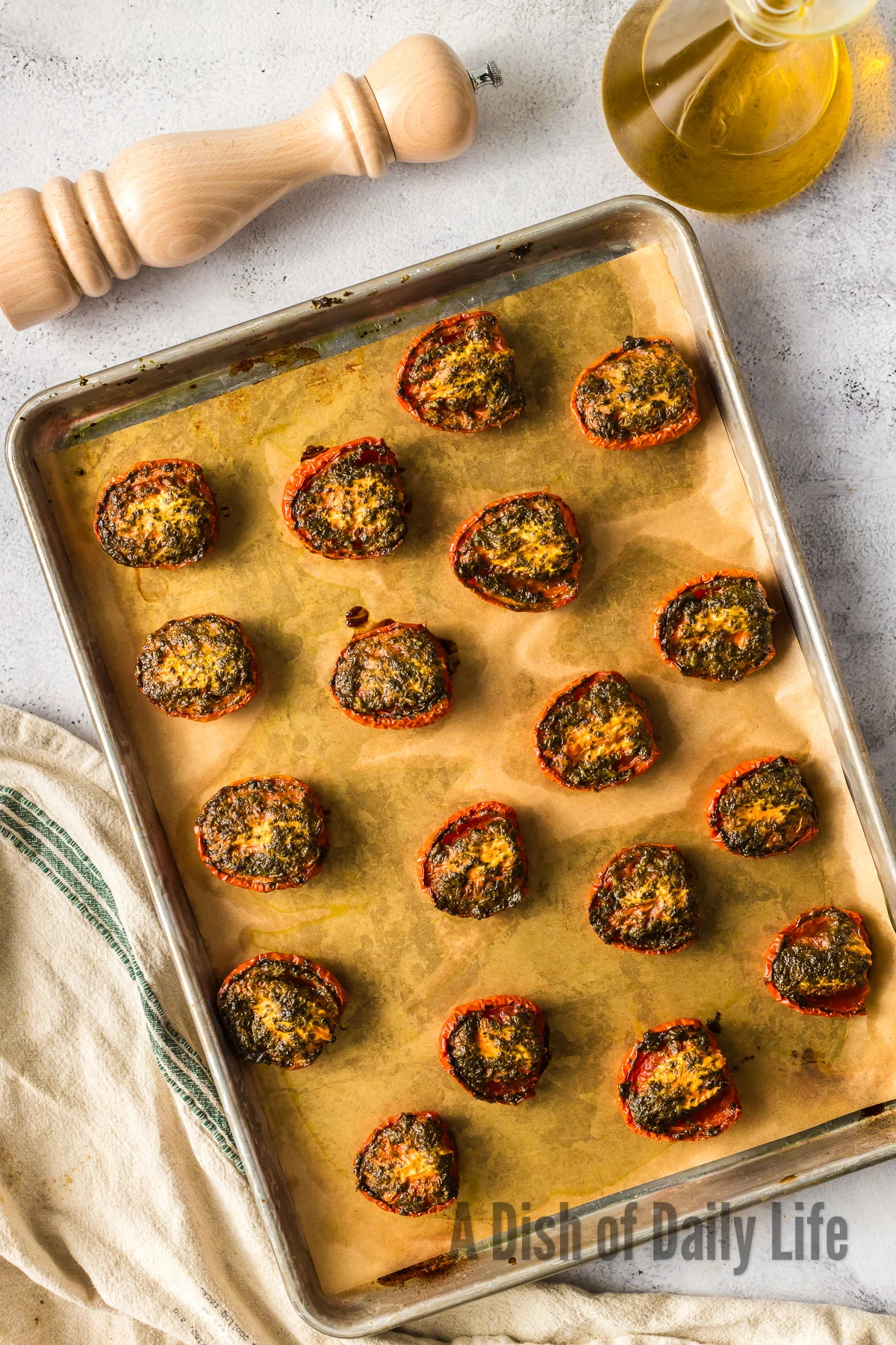 baked cilantro tomatoes laid out on baking sheet