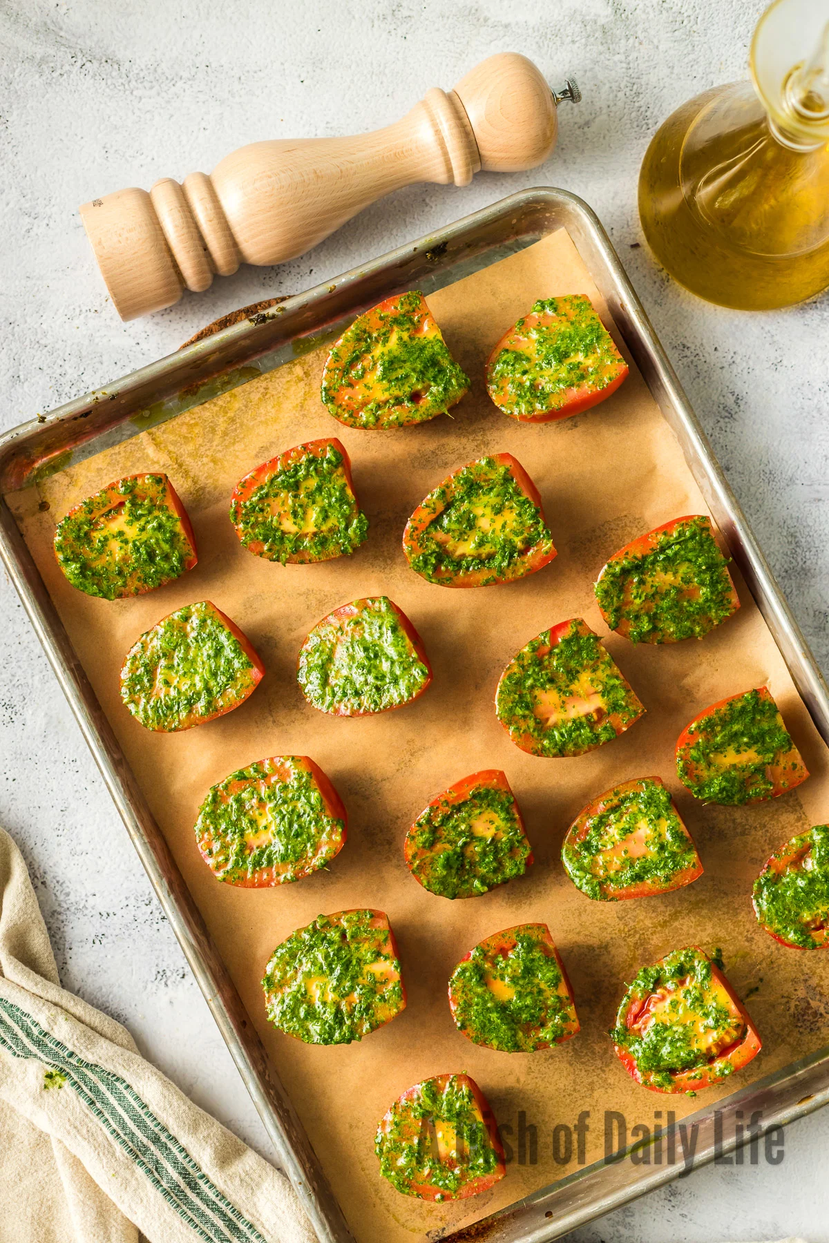 Cilantro mixture spread on top of sliced tomatoes