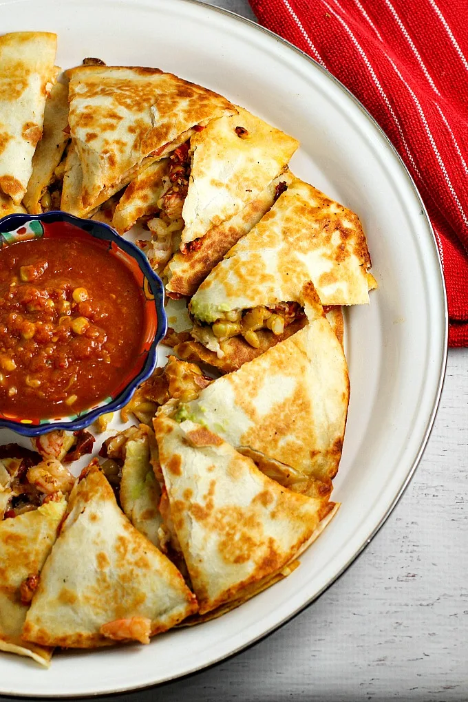 Roasted Tomato, Corn, and Shrimp Quesadillas are a great appetizer for Mexican night, any party or gathering, and of course Cinco de Mayo. Guaranteed rave reviews!