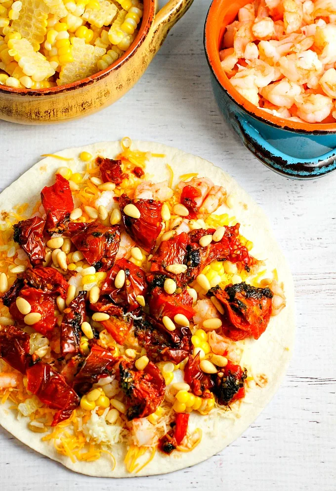 Roasted Tomato, Corn, and Shrimp Quesadillas are a great appetizer for Mexican night, any party or gathering, and of course Cinco de Mayo. Guaranteed rave reviews!