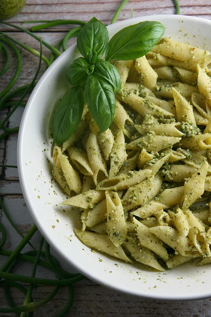 Garlic Scapes Pesto...serve this vegetarian farmer's market favorite over pasta or chicken, spread on sandwiches or paninis, or even as an appetizer dip for bread! It freezes well too.