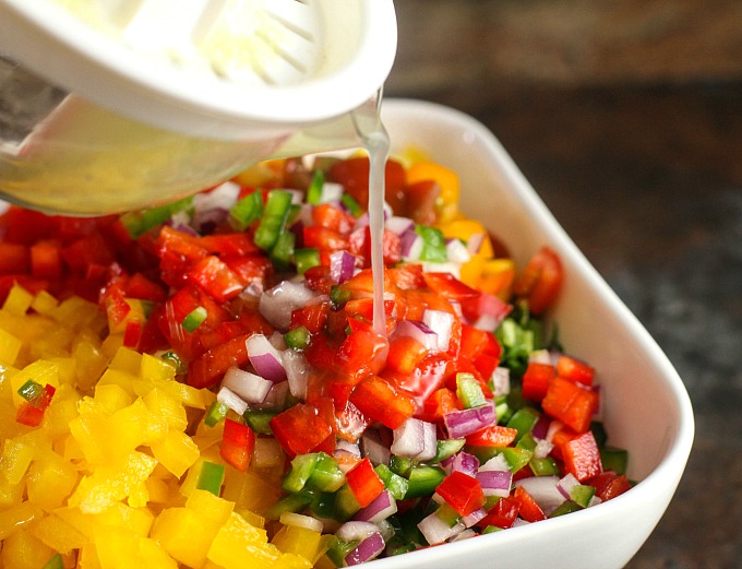 pouring lime juice over salad