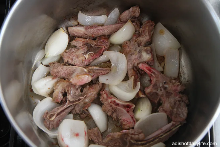 Prepping the bottom of the pot for the stuffed swiss chard leaves