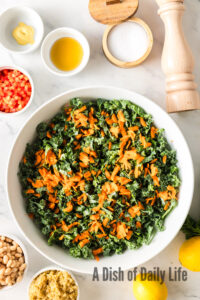 Grated carrots on top of kale