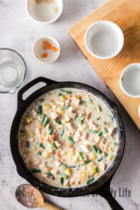 cream of mushroom soup, milk and water added to veggies.