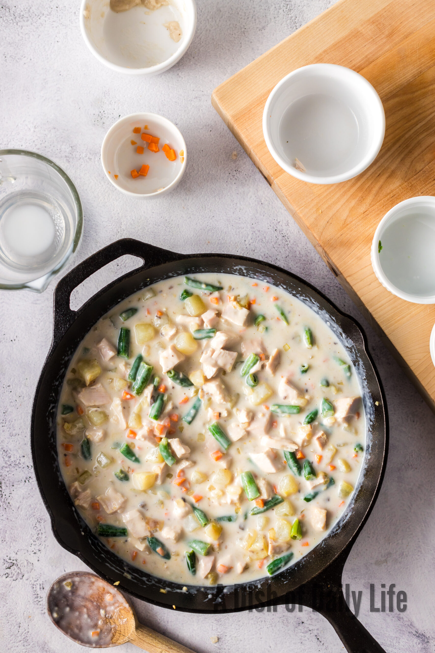 cream of mushroom soup, milk and water added to veggies.