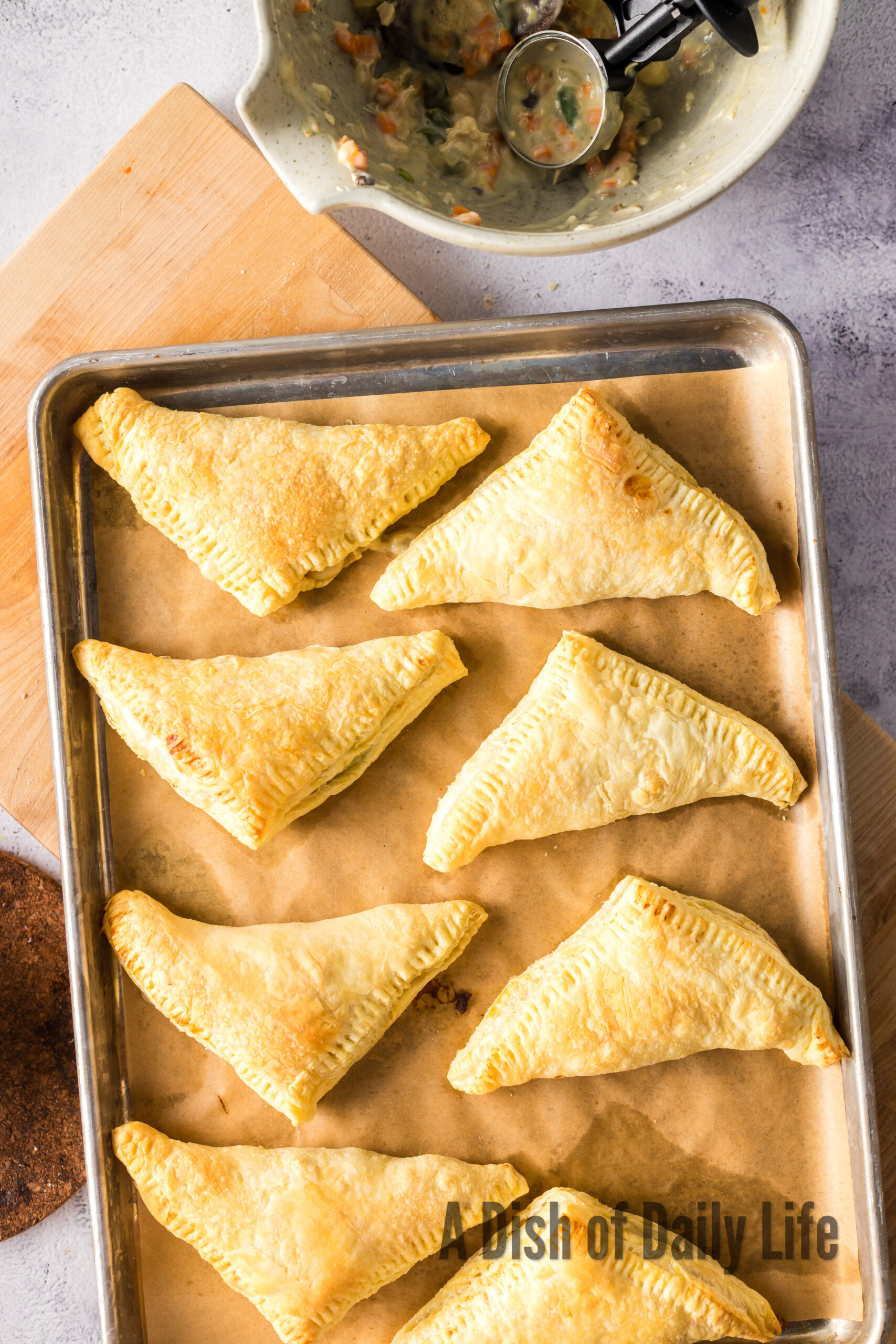 Baked hand pies on baking sheet fresh from the oven.