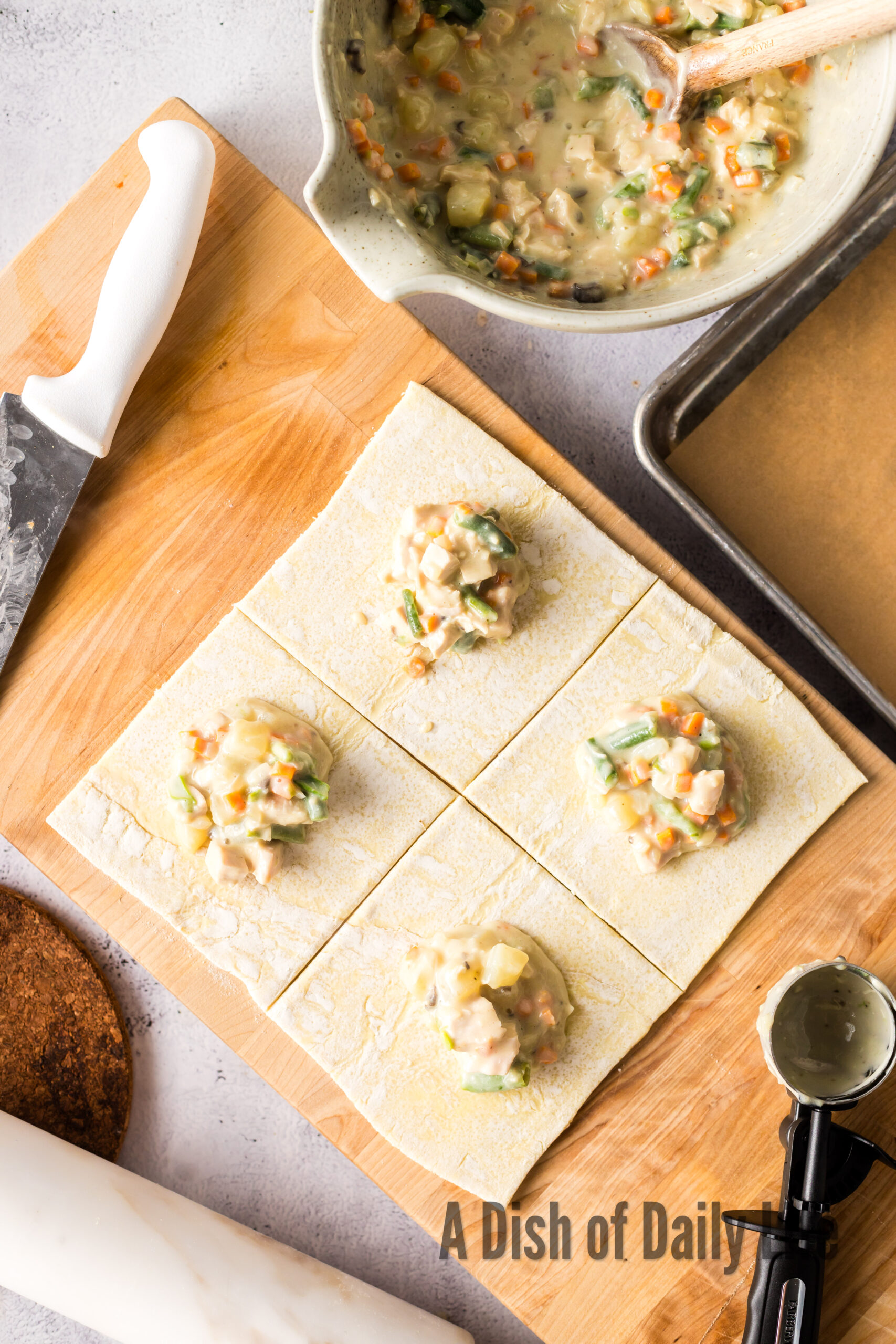 puff pastry cut into 4 pieces with a dollop of filling in the middle of each.