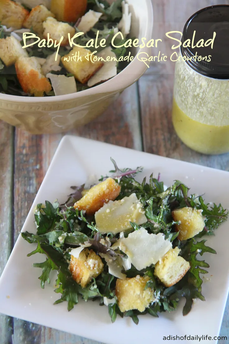 Trade traditional romaine lettuce for vitamin rich baby kale in this delicious Baby Kale Caesar Salad with Homemade Garlic Croutons