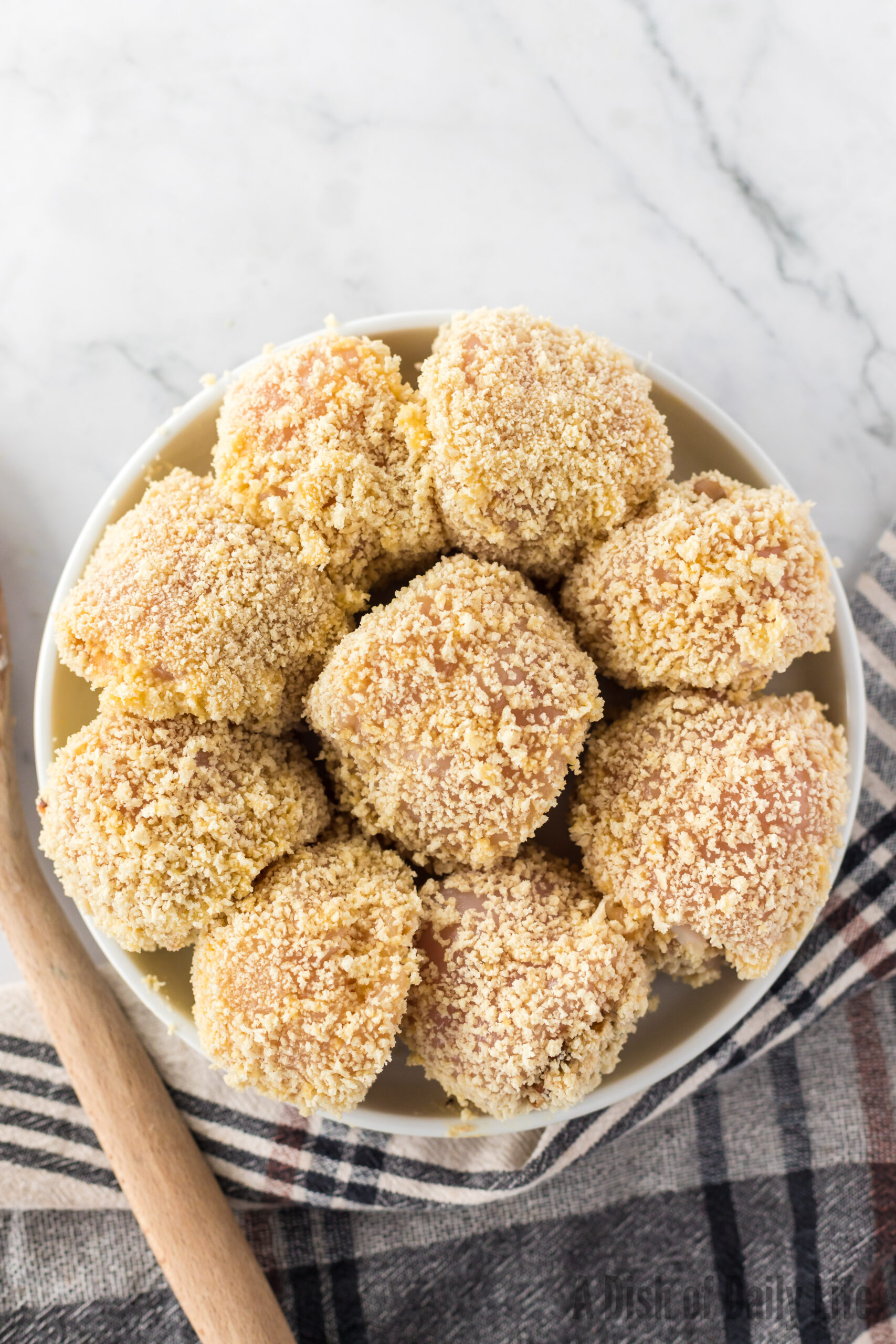 caramelized onion stuffed chicken rolled in egg and bread crumbs