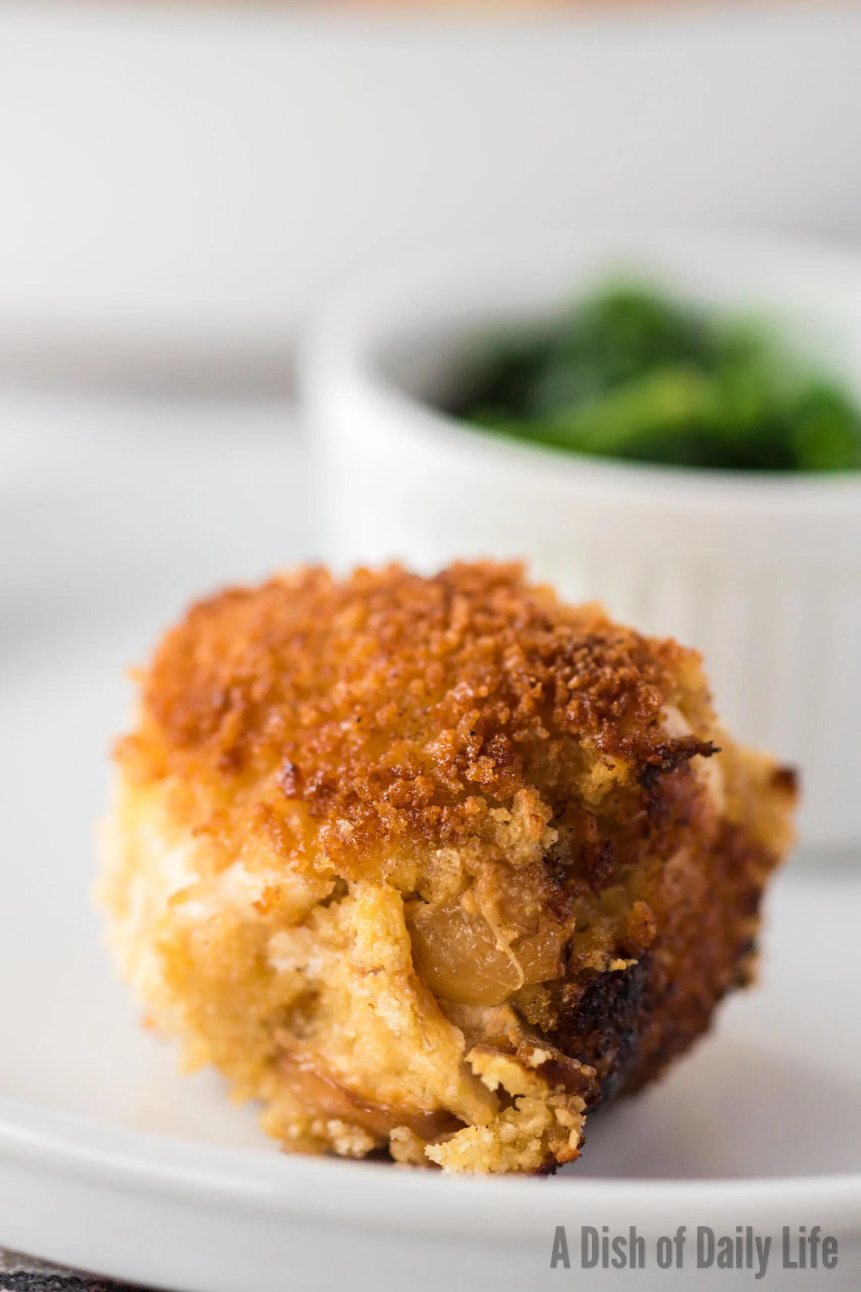 Cooked goat cheese stuffed chicken on a plate