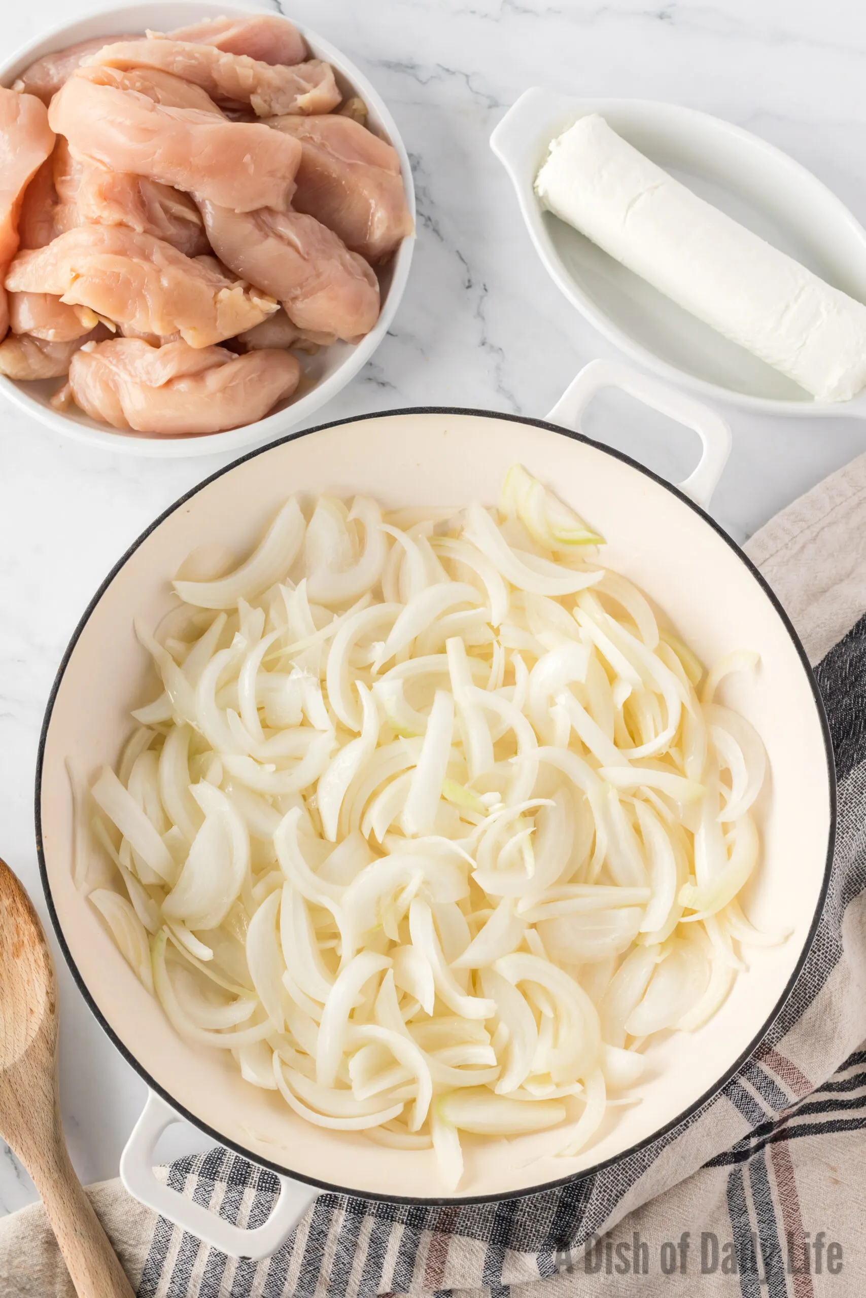 sliced Vidalia onions in a pot with butter