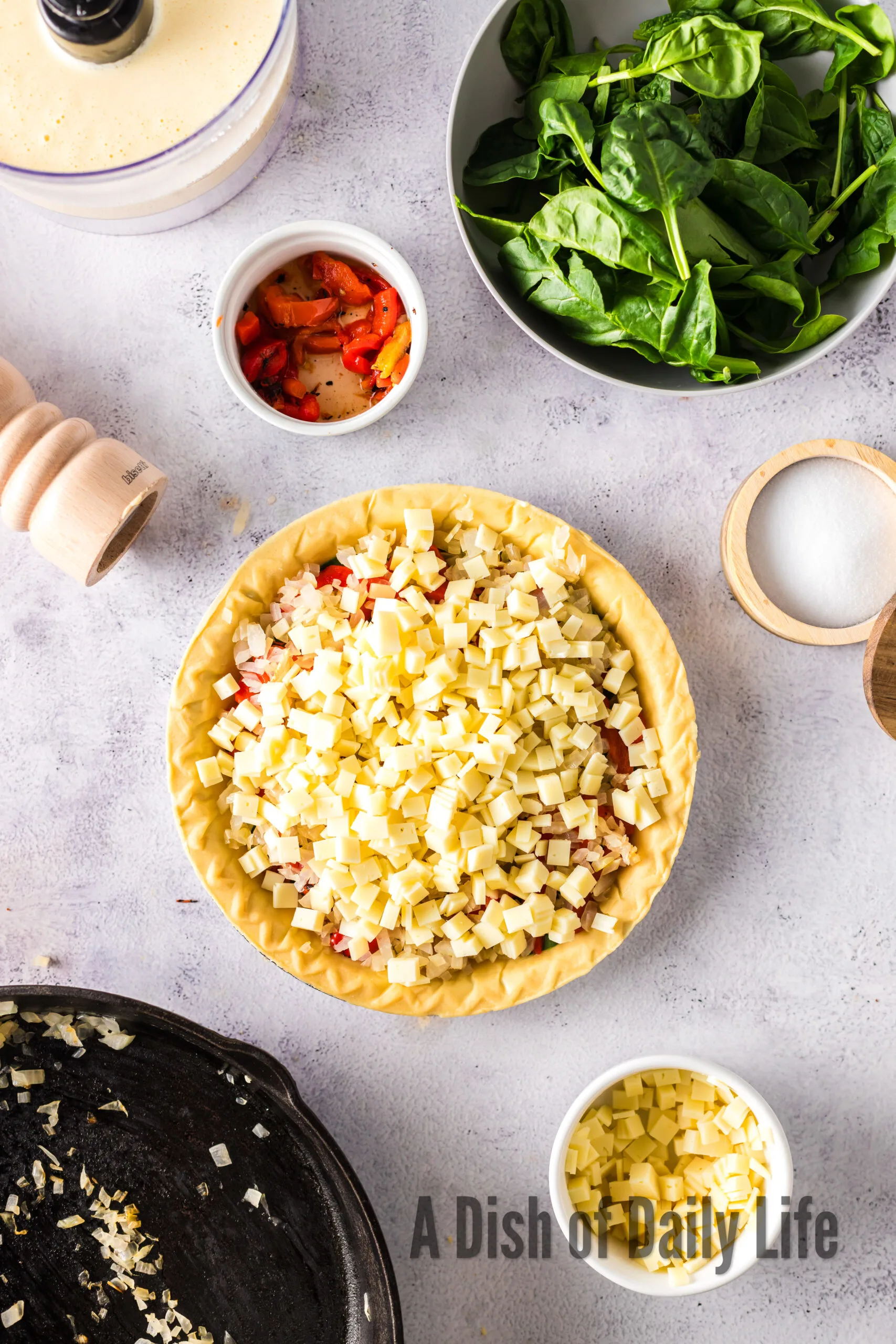 Cheese grated on top of quiche