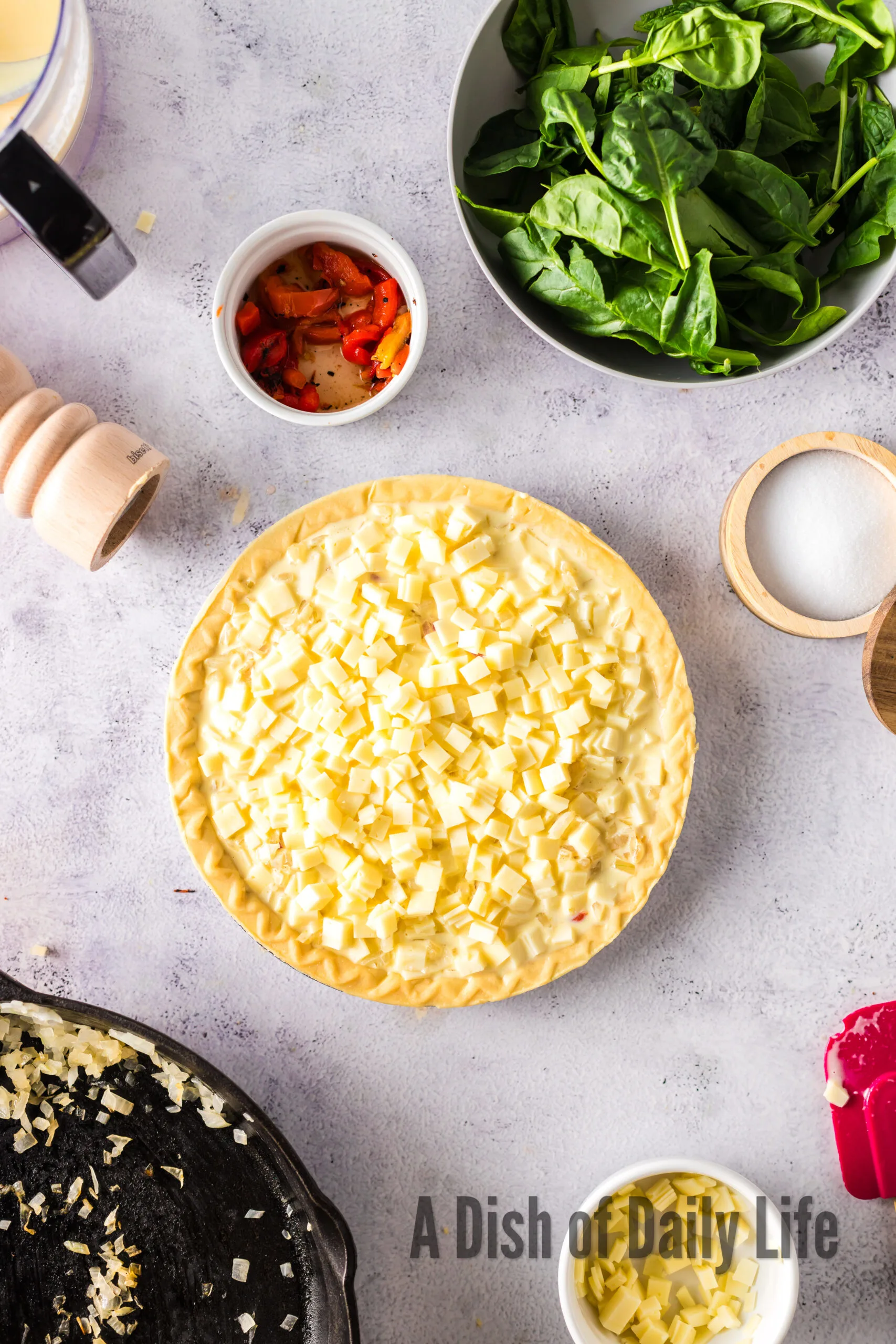 Egg mixture poured over the top of quiche. Ready to bake.