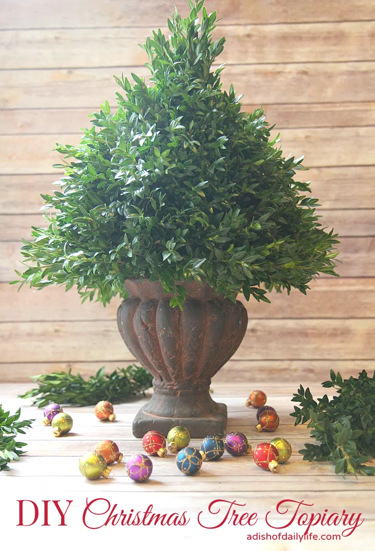 This easy DIY Christmas Tree Topiary is perfect for a hostess gift or holiday decorating!