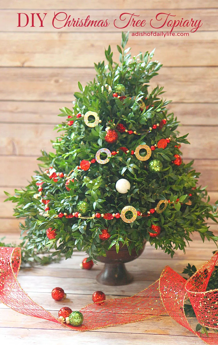 This festive DIY Christmas Tree Topiary is perfect for a hostess gift or for holiday decorating!