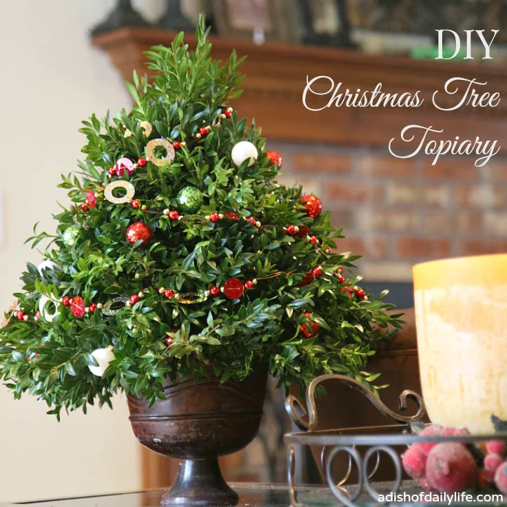 This festive DIY Christmas Tree Topiary is perfect for holiday decorating and gift giving!