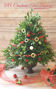 This festive DIY Christmas topiary tree is perfect for a hostess gift or holiday decorating