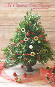 This festive DIY Christmas topiary tree is perfect for a hostess gift or holiday decorating