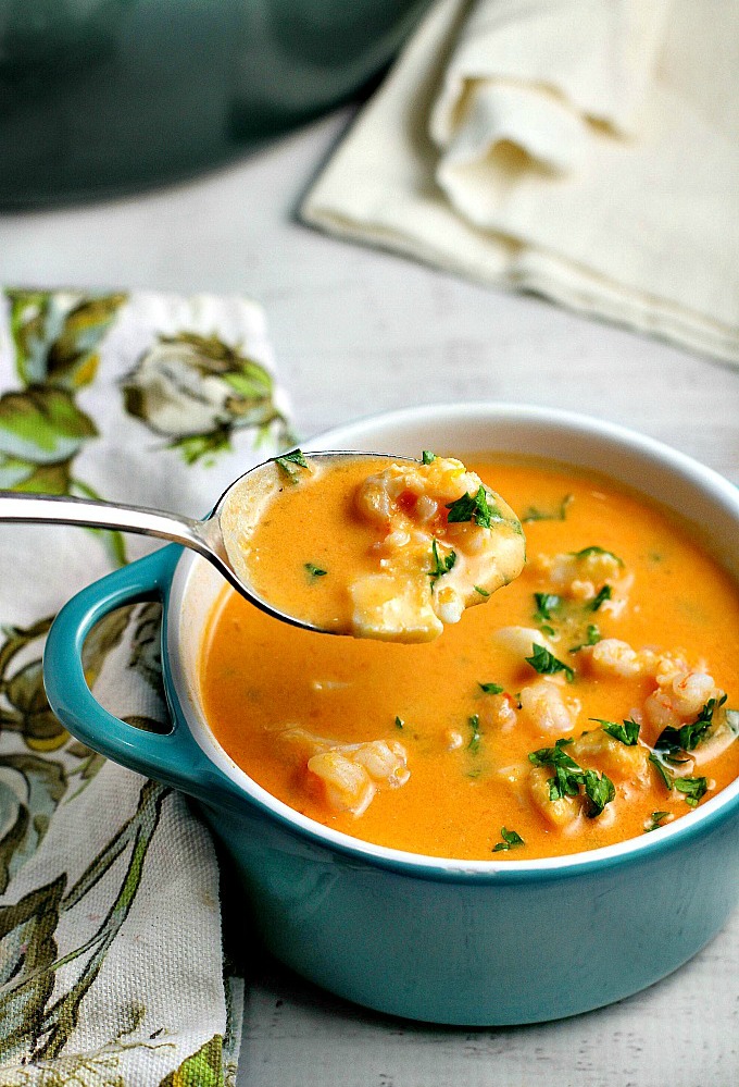 Tomatoes and cream cheese add a rich creaminess to this delicious seafood bisque recipe. You won't be able to stop at just one bowl!