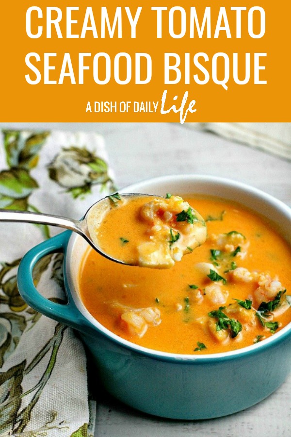 Creamy Tomato Seafood Bisque...tomatoes and cream cheese add a rich creaminess to this delicious seafood bisque recipe. #soup #bisque #tomatosoup #seafood #seafoodsoup