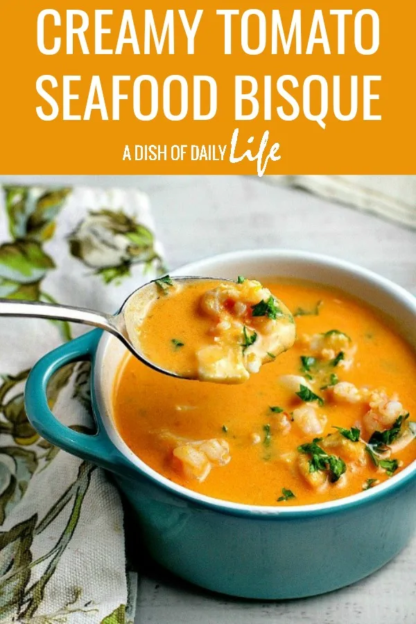 Creamy Tomato Seafood Bisque...tomatoes and cream cheese add a rich creaminess to this delicious seafood bisque recipe. #soup #bisque #tomatosoup #seafood #seafoodsoup