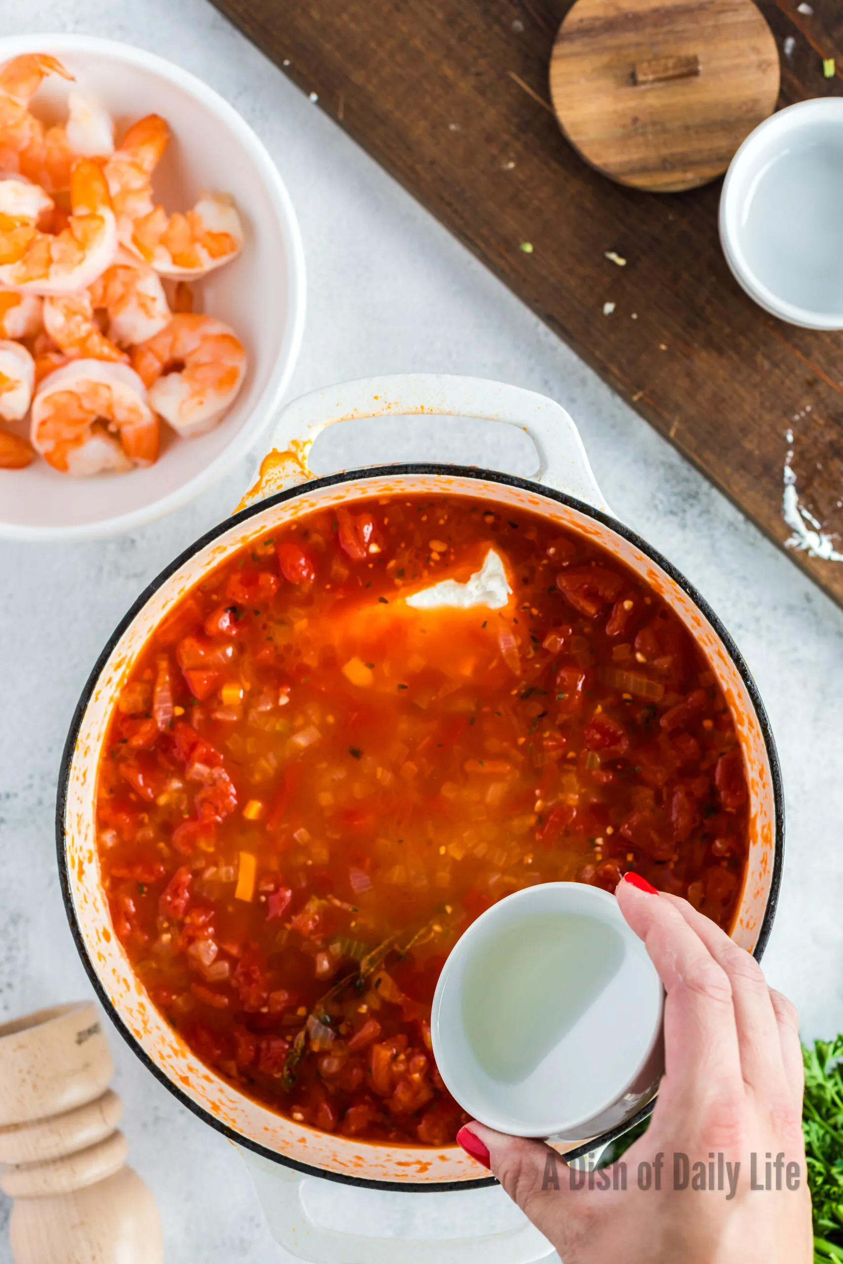 cream cheese and cooking sherry added to soup pot