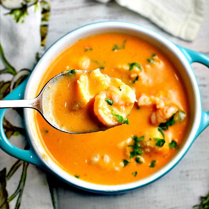 Tomatoes and cream cheese add a rich creaminess to this delicious seafood bisque recipe. You won't be able to stop at just one bowl!