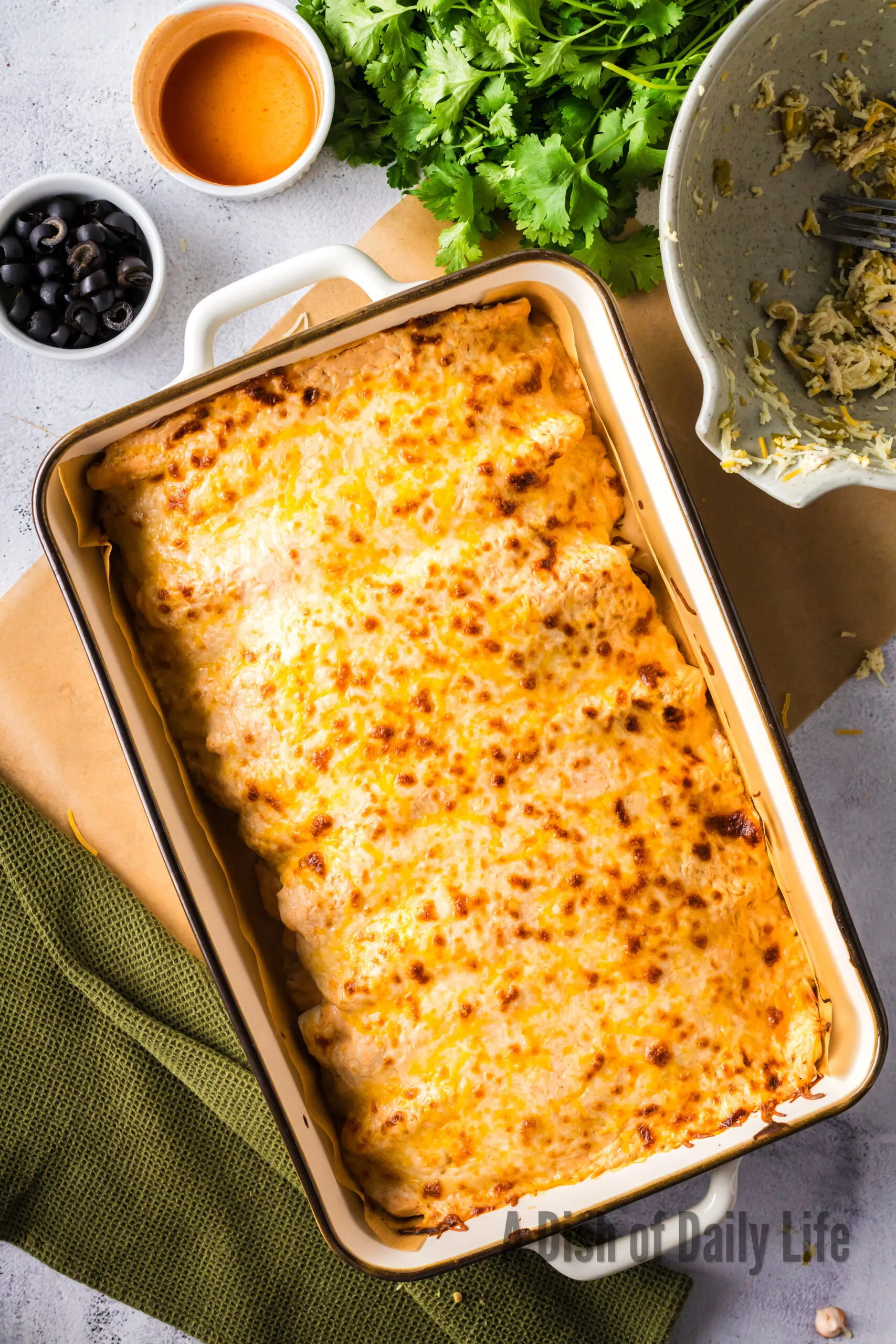 Baked Red Chicken Enchiladas in pan fresh out of oven