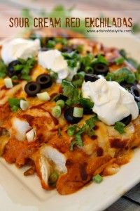 These cheesy sour cream red enchiladas are sure to be a hit for Mexican night!