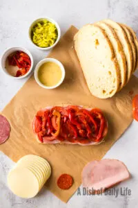 roasted red bell peppers layered on top of tomatoes