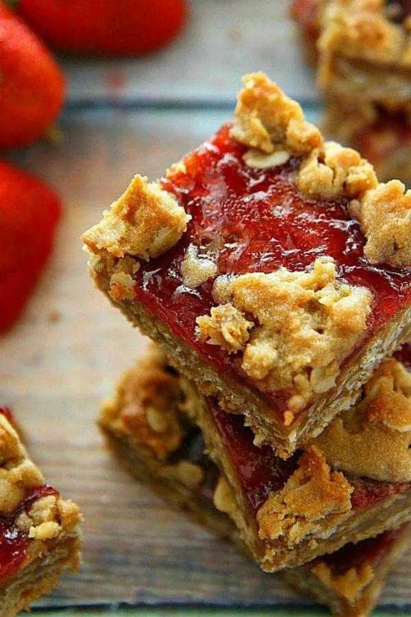 The classic sandwich becomes a cookie! PB&J Cookie Bars with Strawberry Jam are easy to make, and a delicious way to satisfy your sweet tooth craving. #cookies #barcookies #peanutbutterandjelly