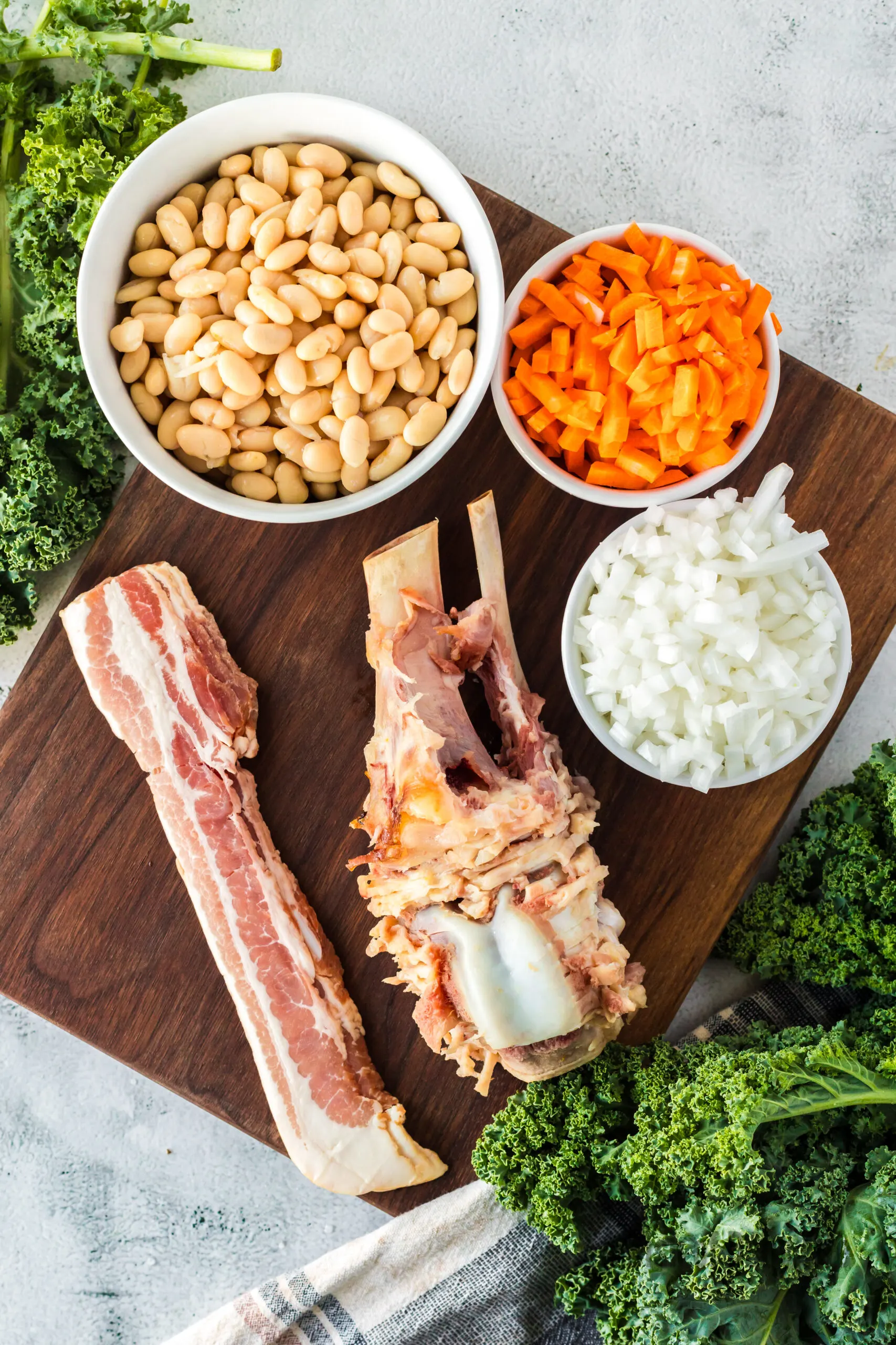 All ingredients for ham bone soup laid out on counter