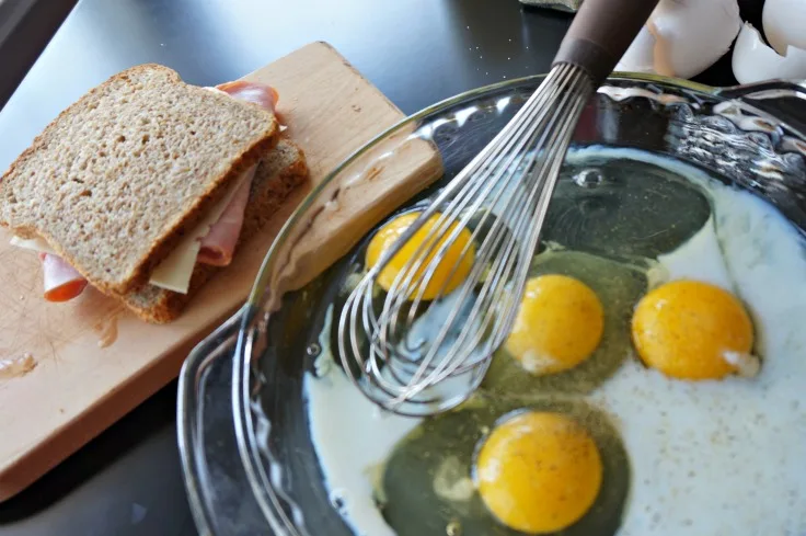 Preparing the egg batter for monte cristo