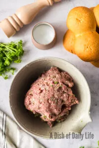 All ingredients for burgers mixed together in a bowl
