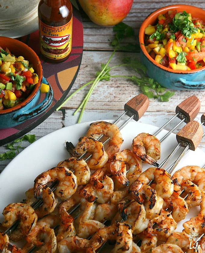 Mango Chipotle Shrimp...sweet mango paired with smoky chipotle makes for a barbeque sauce sensation! Perfect for dinner on the patio or a summer party, this grilling recipe takes just over 30 minutes from start to finish.