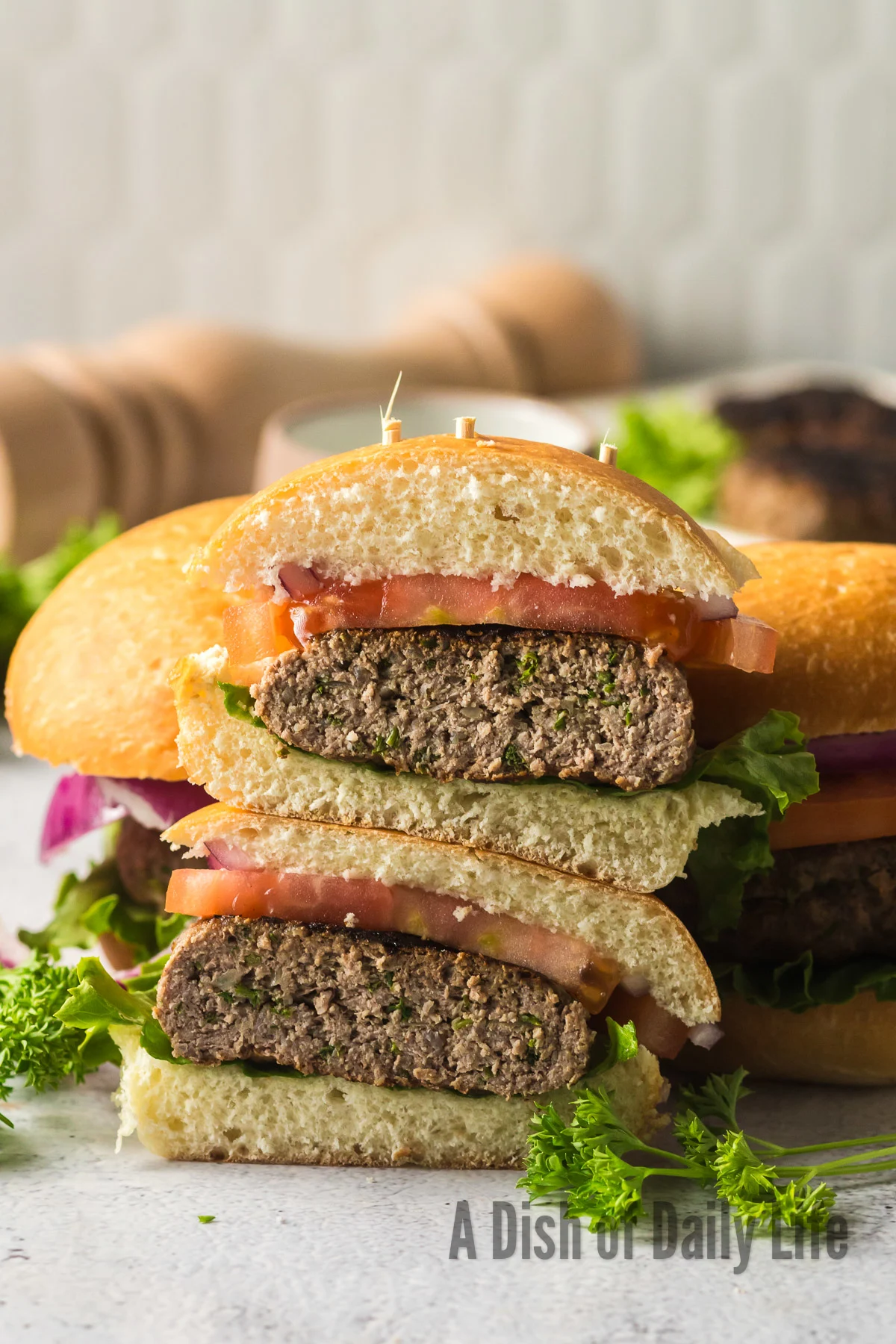 burgers cut in half to show yummy meat patty.