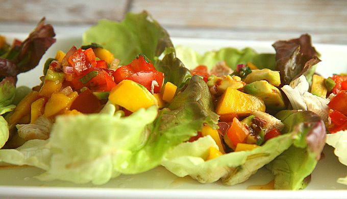 Healthy and delicious, these Chicken Lettuce Wraps with Avocado Mango Salsa are an easy dinner that you can have on the table in less than 30 minutes! 