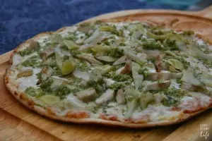 Grilled Freschetta Gluten Free pizza with pesto, artichoke hearts, and chicken