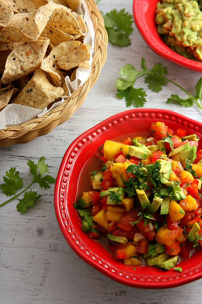 Get ready for a flavor explosion of deliciousness with this Avocado Mango Salsa recipe! This crowd pleaser is great as a party appetizer served with chips, or served as an accompaniment to seafood or chicken.