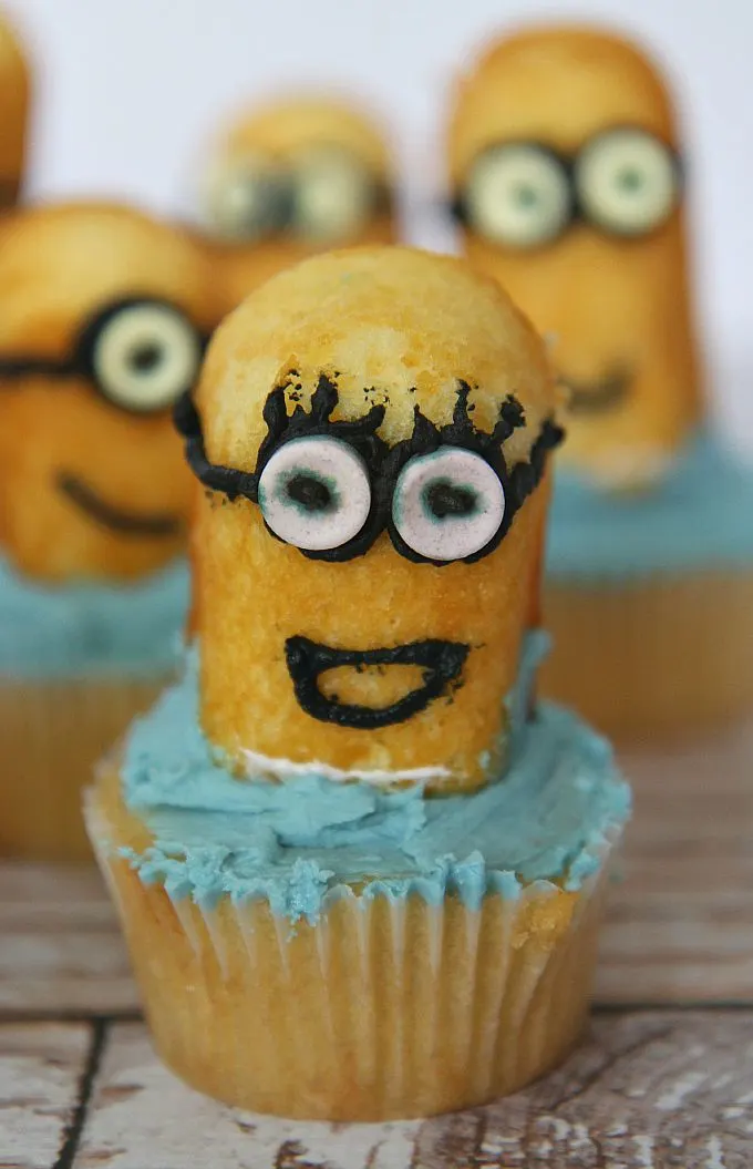 Easy Minion Cupcakes tutorial guaranteed to please any Minion fan! Fun baking project to do with your kids, grandkids, or even when babysitting!