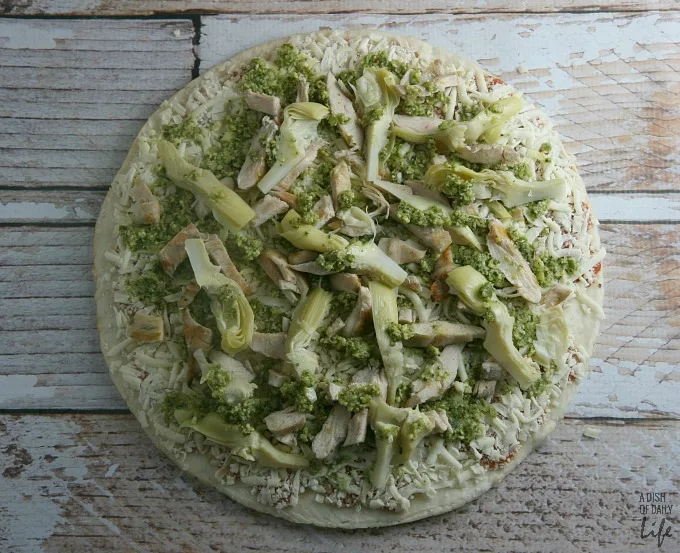 Pesto, artichoke and chicken pizza