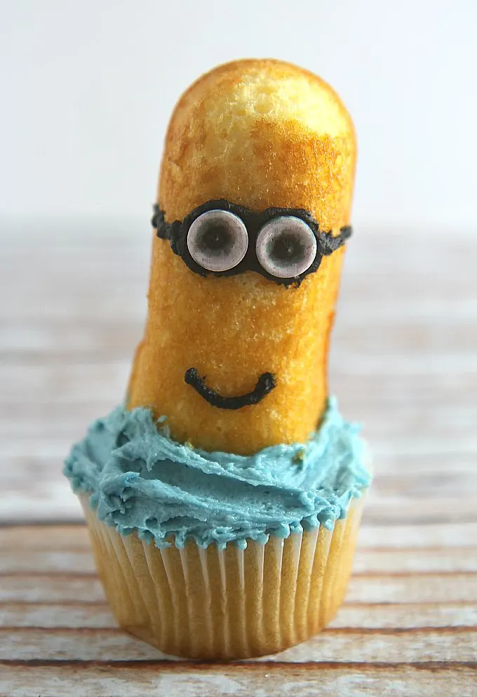 Easy Minion Cupcakes tutorial guaranteed to please any Minion fan! Fun baking project to do with your kids, grandkids, or even when babysitting!