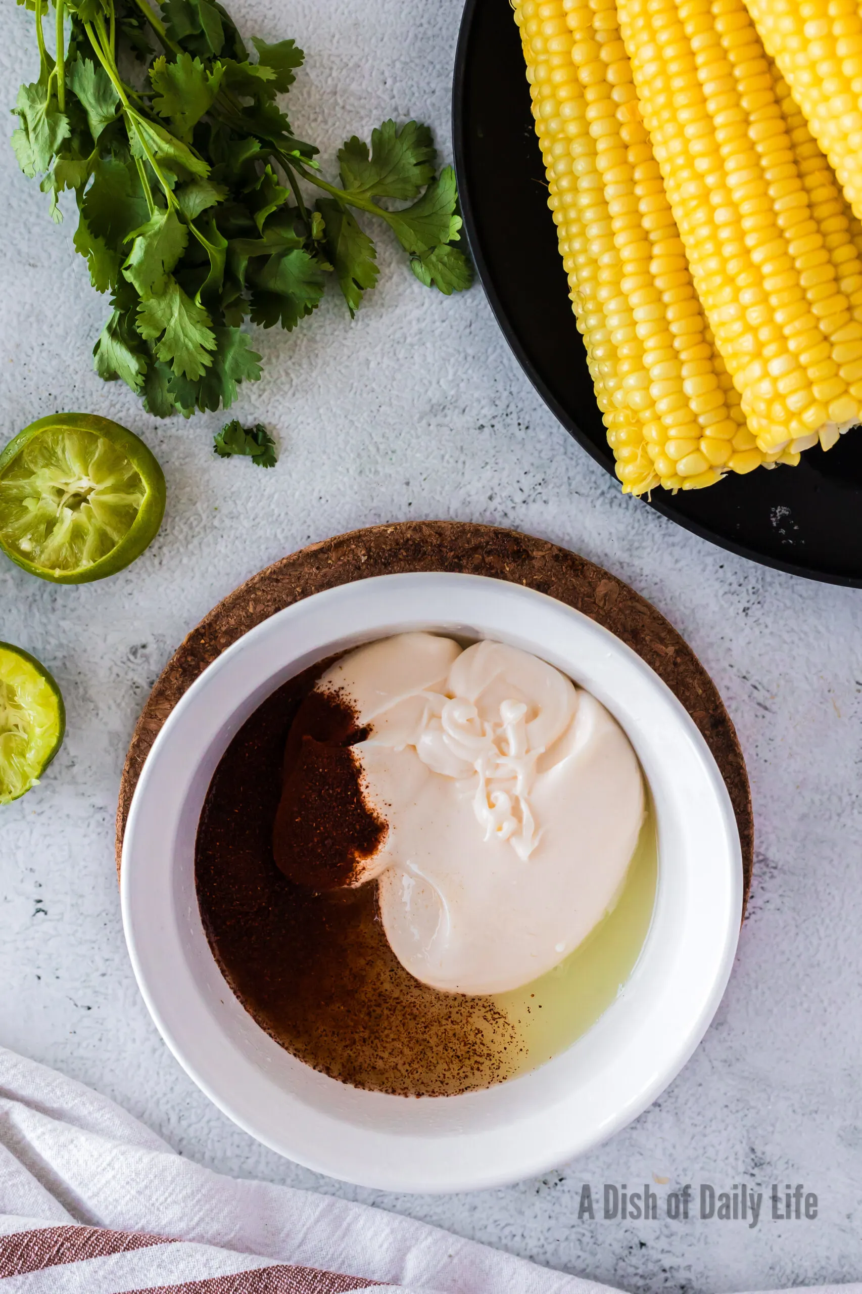 Mayonnaise, chili powder, and lime juice in a small mixing bowl.