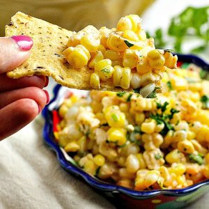 Like Mexican street corn? Turn it into a salad! This easy and delicious 15 minute Chili Lime Mexican Corn Salad recipe can be used as an appetizer for game day or tailgating, or as a side dish for any Mexican dinner or your next cookout!