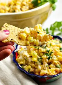 Like Mexican street corn? Turn it into a salad! This easy and delicious 15 minute Chili Lime Mexican Corn Salad recipe can be used as an appetizer for game day or tailgating, or as a side dish for any Mexican dinner or your next cookout!