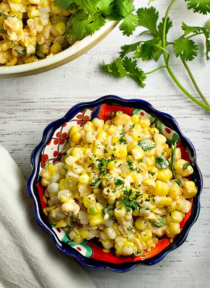 Like Mexican street corn? Turn it into a salad! This easy and delicious 15 minute Chili Lime Mexican Corn Salad recipe can be used as an appetizer for game day or tailgating, or as a side dish for any Mexican dinner or your next cookout!